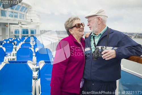 Image of Senior Couple Enjoying The Deck of a Cruise Ship