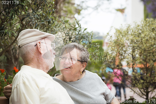 Image of Senior Couple on Bench in the Market Place