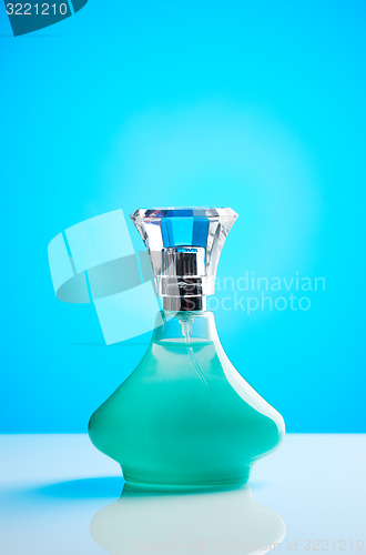 Image of Green bottle of perfume for women