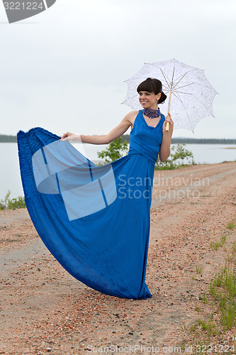 Image of Smiling girl with an umbrella