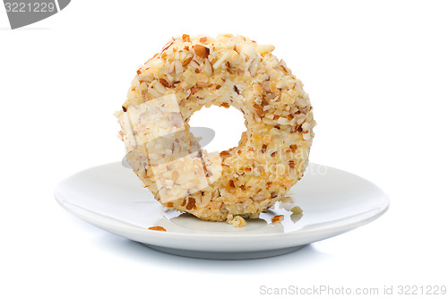 Image of Round sweet dessert cheese with nuts and pineapple.