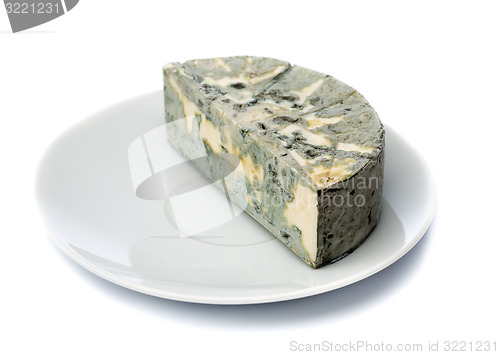 Image of Cheese with black mold on a plate for food lovers.