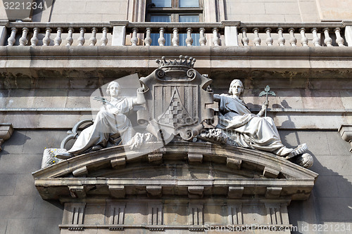 Image of Two maidens on the facade of an old building