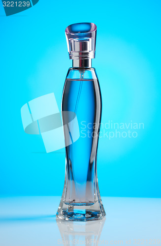 Image of Women\'s perfume bottle on a blue background