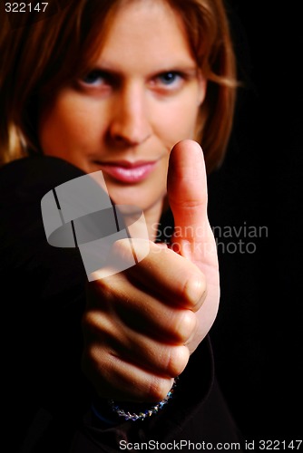 Image of woman shows thumb