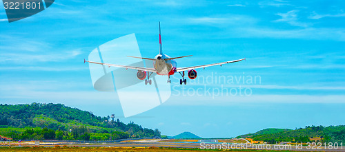 Image of Commercial Airliner Landing at an Airport in Southeast Asia