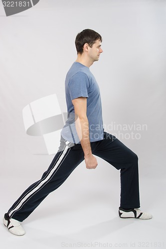 Image of The young man does exercise