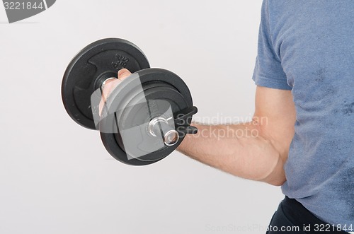 Image of Hand athlete with dumbbell