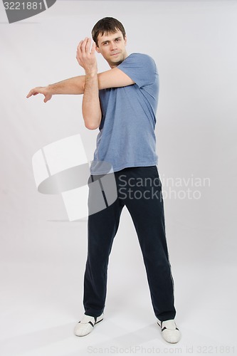 Image of Athlete flexing arm muscles