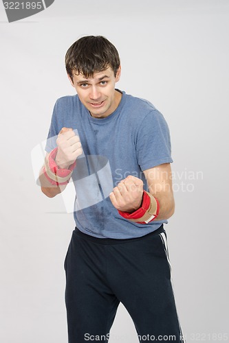 Image of Athlete fulfills punches with the weighting