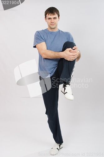 Image of Athlete flexing muscles of the legs