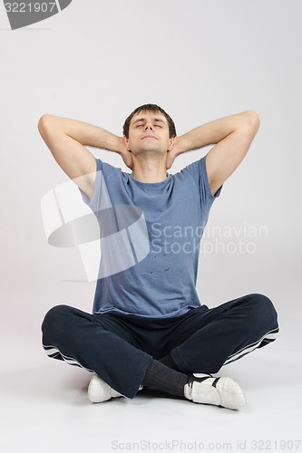 Image of Athlete stretching his neck, leaned back