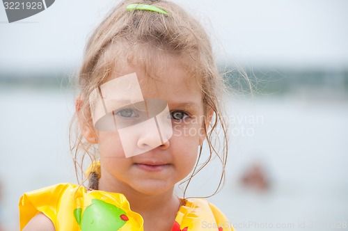 Image of Portrait of a three-year girl on the beach