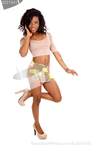 Image of Young African woman in skirt.
