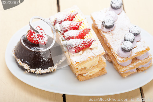 Image of selection of fresh cream cake dessert plate 