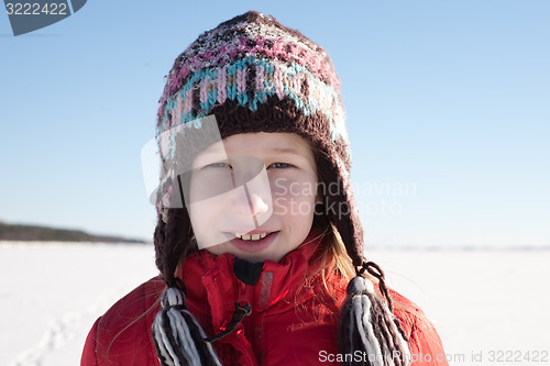 Image of young girl in knitted cap