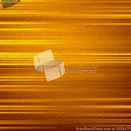 Image of Abstract gold background. Metal plate with reflected light. 