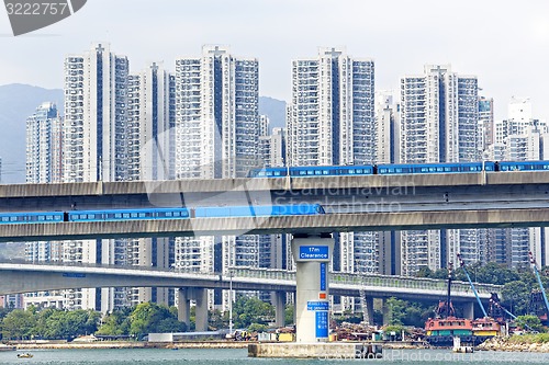 Image of high speed train on bridge in hong kong downtown city