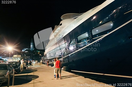 Image of People sightseeing moored yacht in Rovinj