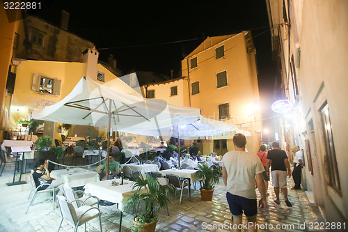 Image of Tourists sitting in restaurant 