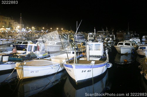 Image of Boats in marina at night