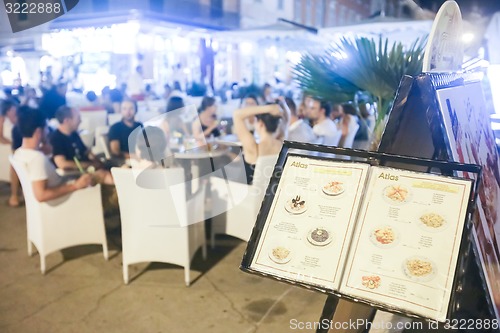 Image of Tourist menu displayed in front of restaurant on promenade