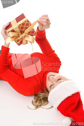 Image of Female unties a Christmas present