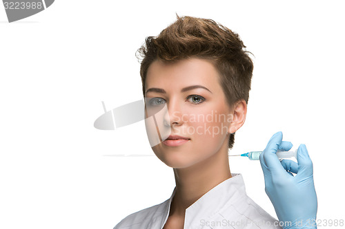 Image of pretty young woman and vaccine syringe