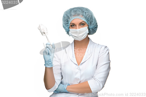 Image of Portrait of lady surgeon holding surgical instrument over white background