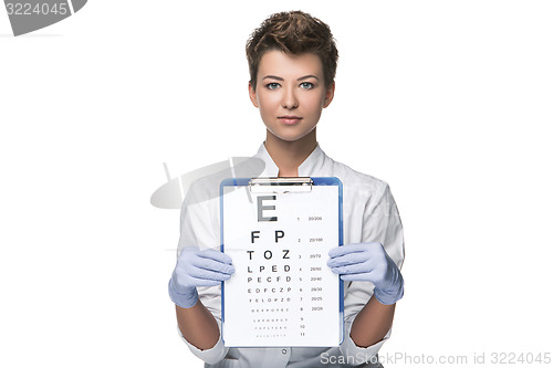 Image of young woman ophthalmologist with eye chart