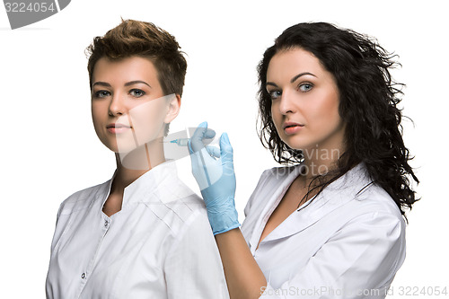 Image of Doctor giving an injection to female patient