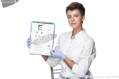 Image of young woman ophthalmologist with eye chart