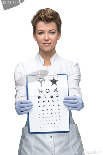 Image of young woman ophthalmologist with eye chart