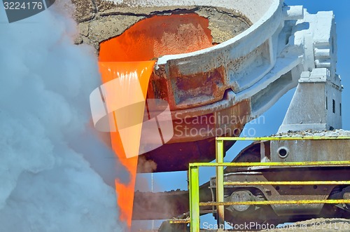 Image of steel is poured into the slag dump