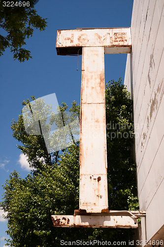 Image of Home Furnishings Retail Store Sign Downtown Faded Away