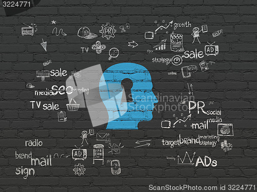 Image of Advertising concept: Head With Keyhole on wall background