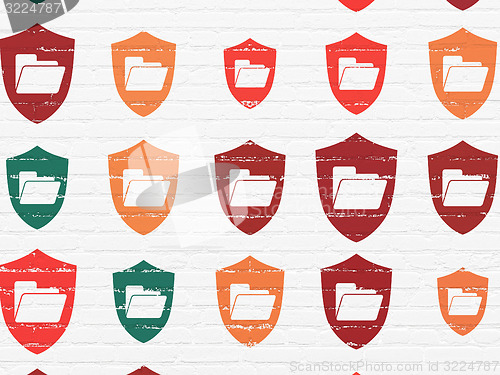 Image of Business concept: Folder With Shield icons on wall background