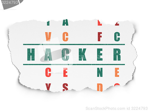 Image of Security concept: word Hacker in solving Crossword Puzzle