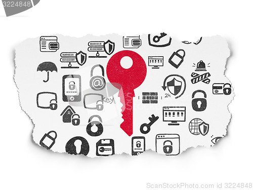 Image of Protection concept: Key on Torn Paper background