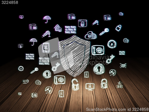 Image of Safety concept: Shield in grunge dark room