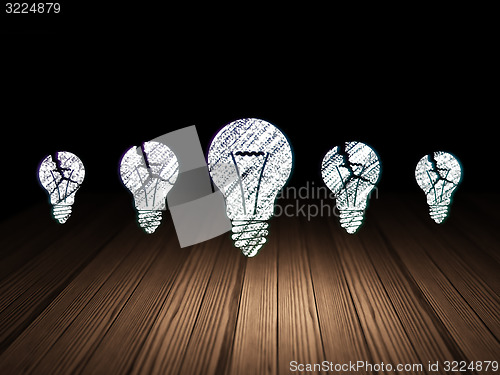 Image of Finance concept: light bulb icon in grunge dark room