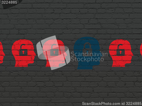 Image of Business concept: head with padlock icon on wall background