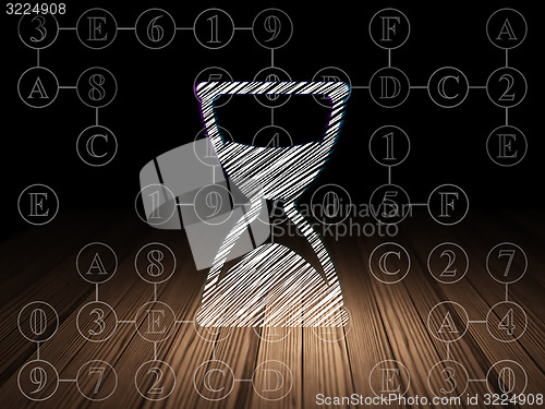 Image of Time concept: Hourglass in grunge dark room