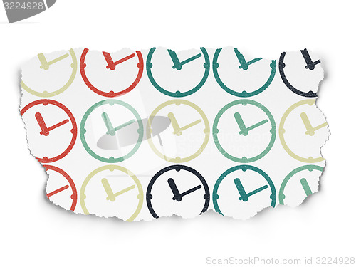 Image of Time concept: Clock icons on Torn Paper background
