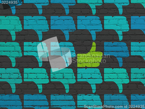 Image of Social network concept: thumb up icon on wall background