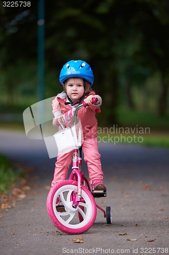 Image of little girl with bicycle