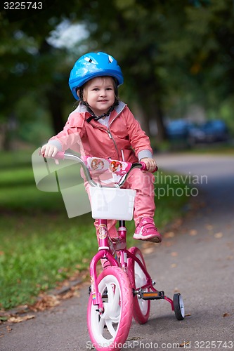 Image of little girl with bicycle