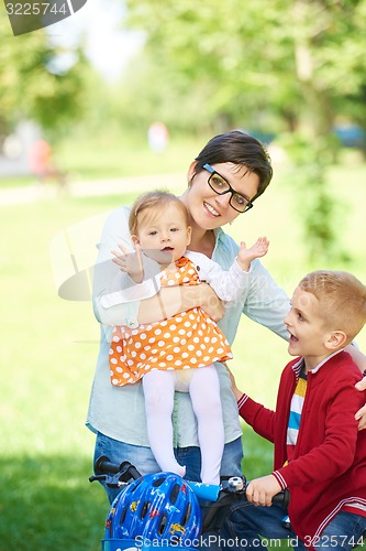 Image of happy young family in park