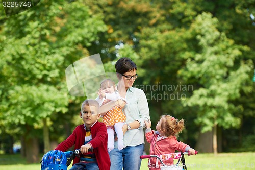 Image of happy young family in park
