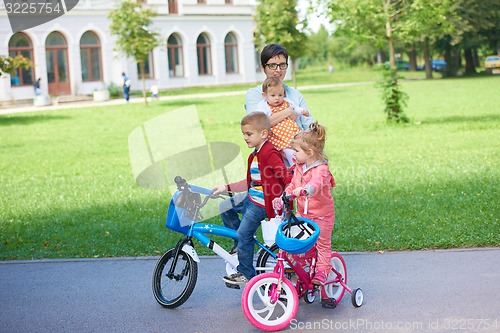 Image of happy young family in park